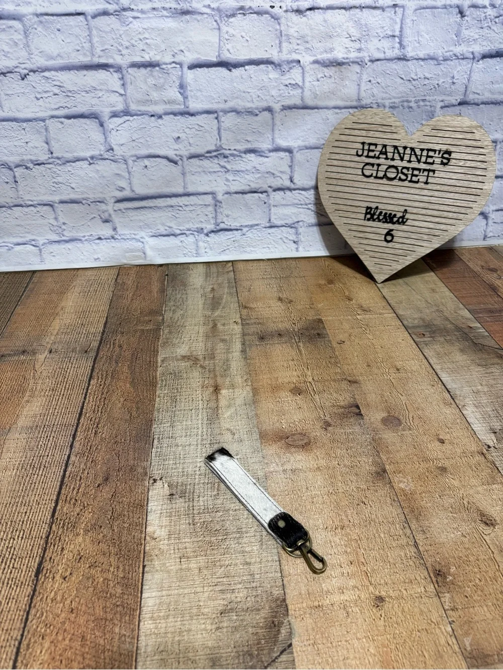 keychain hair-on-hide cowhide strap paired with a brass hook